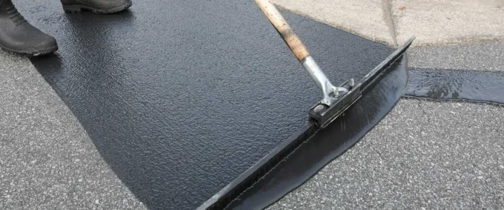 person applying sealcoat