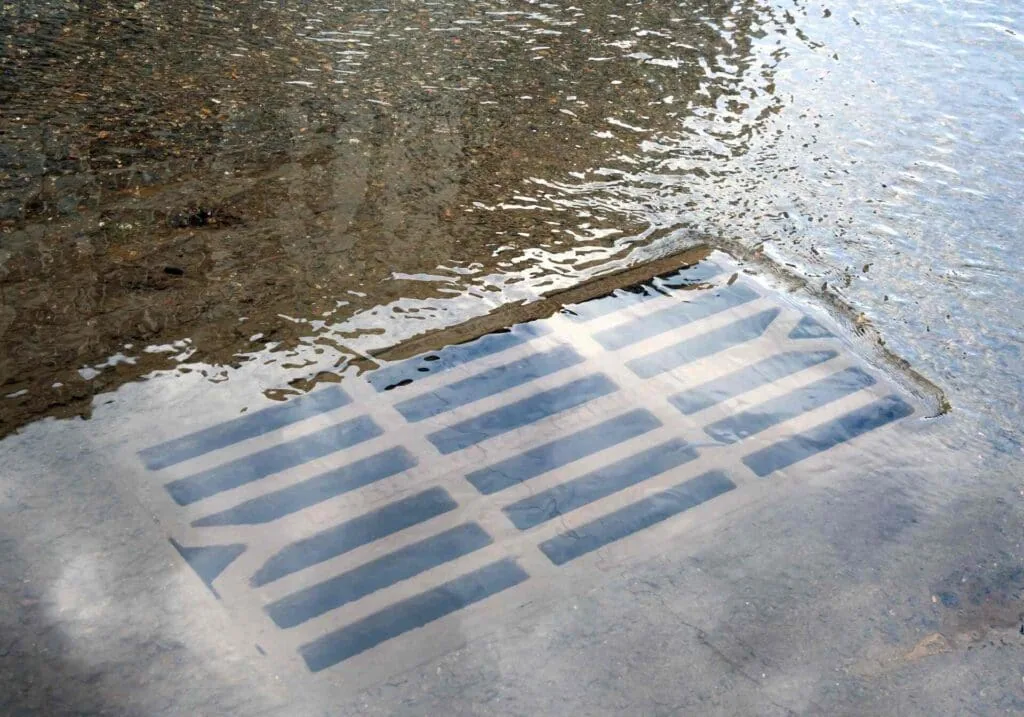 parking lot drainage solutions such as this flooded storm drain